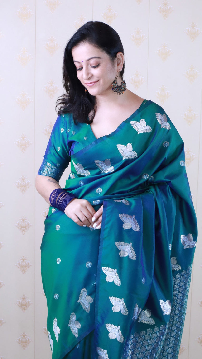 Green soft silk dual zari woven saree with bird border