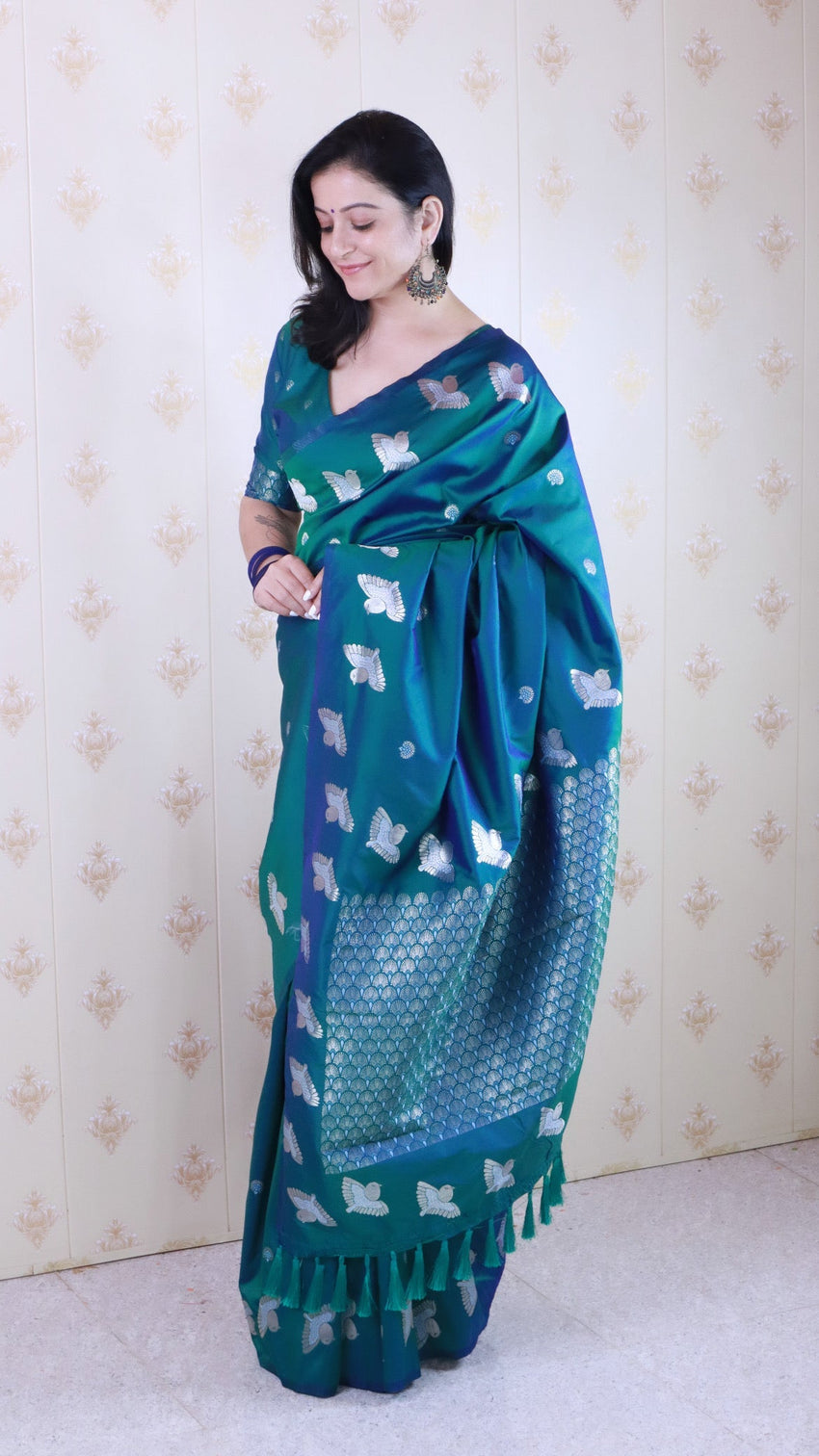 Green soft silk dual zari woven saree with bird border