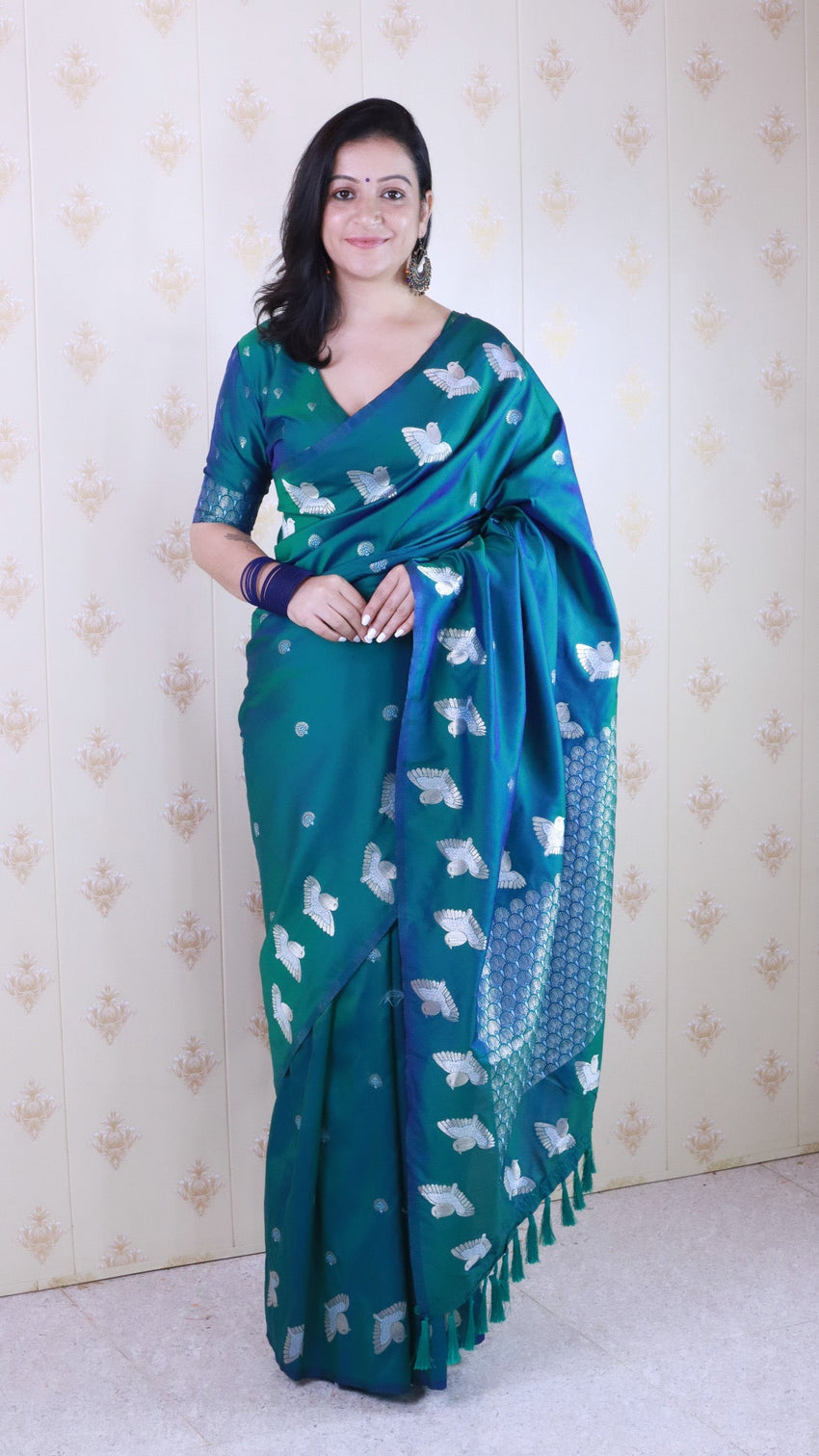 Green soft silk dual zari woven saree with bird border