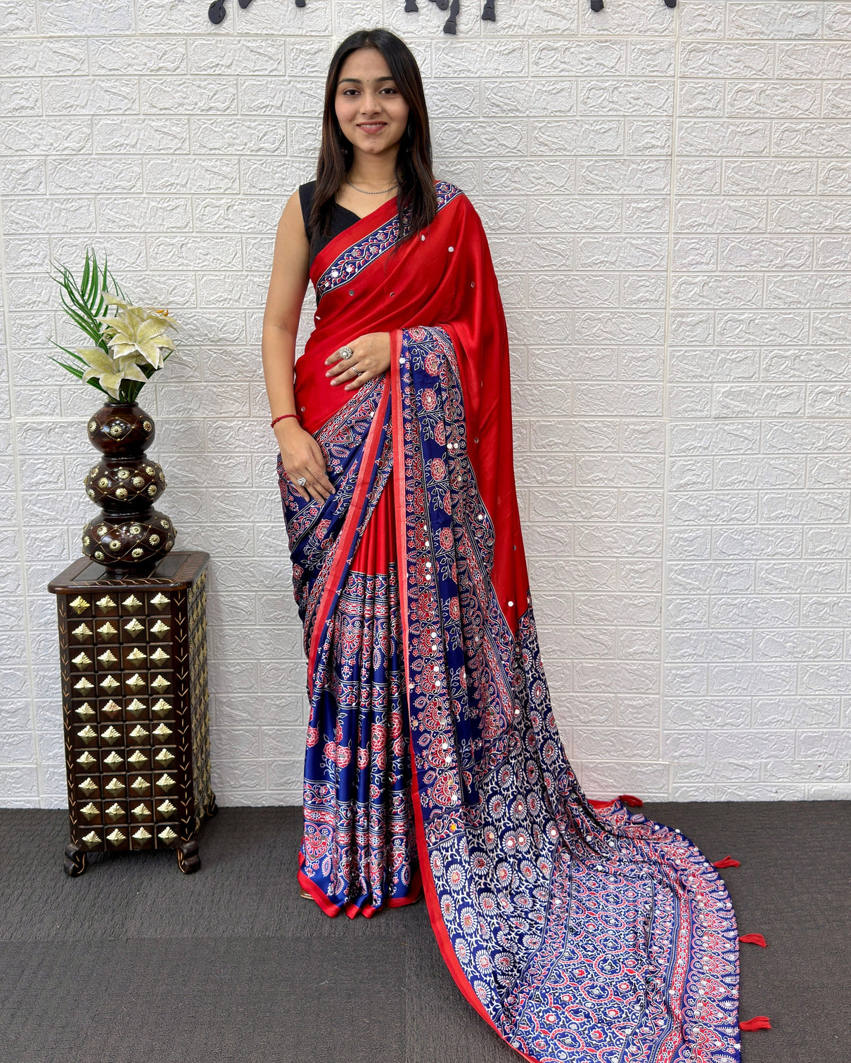 Scarlet red modal silk saree with navy blue ajrakh printed designer pallu tassel detailing festive traditional ethnic wear saree