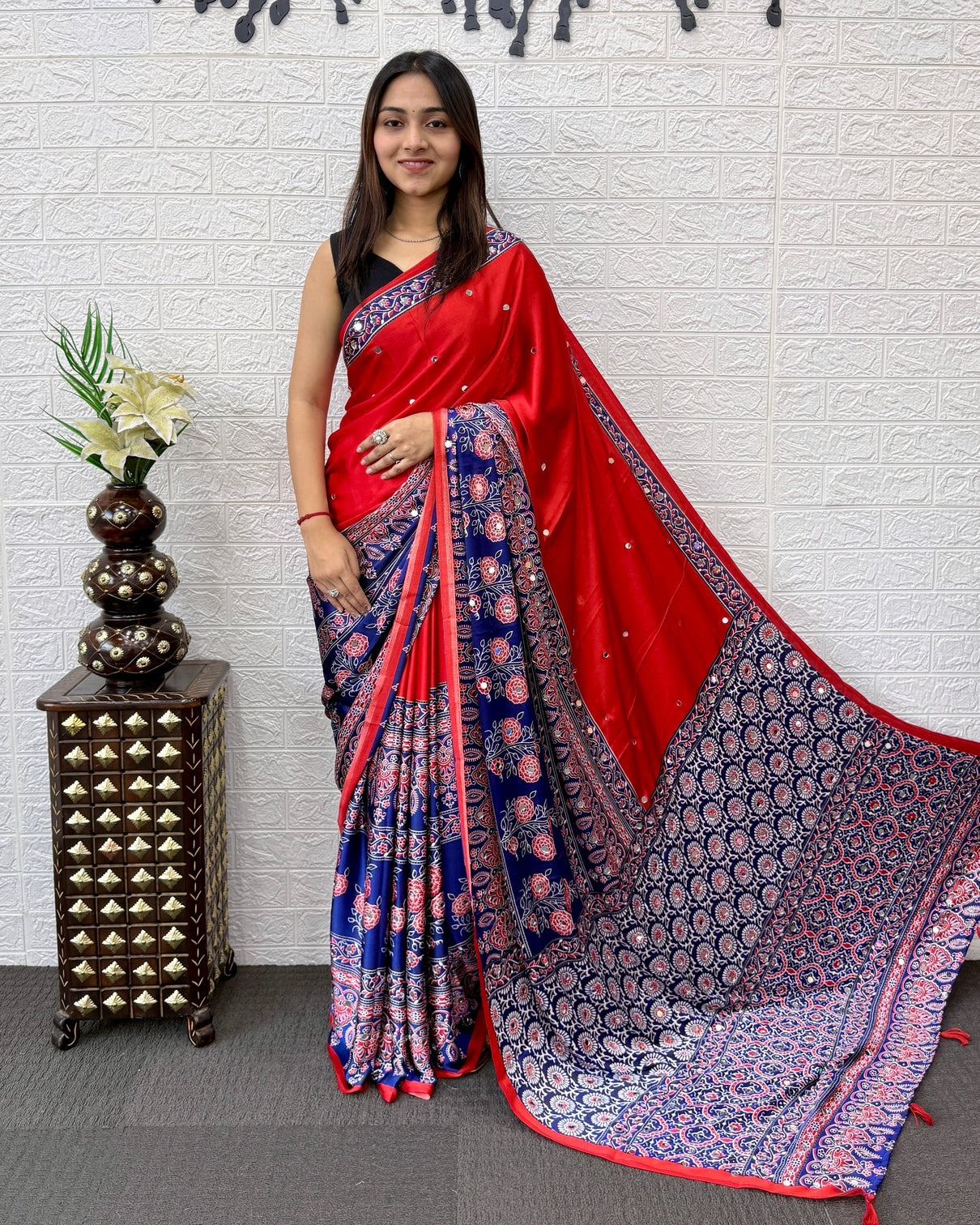 Scarlet red modal silk saree with navy blue ajrakh printed designer pallu tassel detailing festive traditional ethnic wear saree mameraa