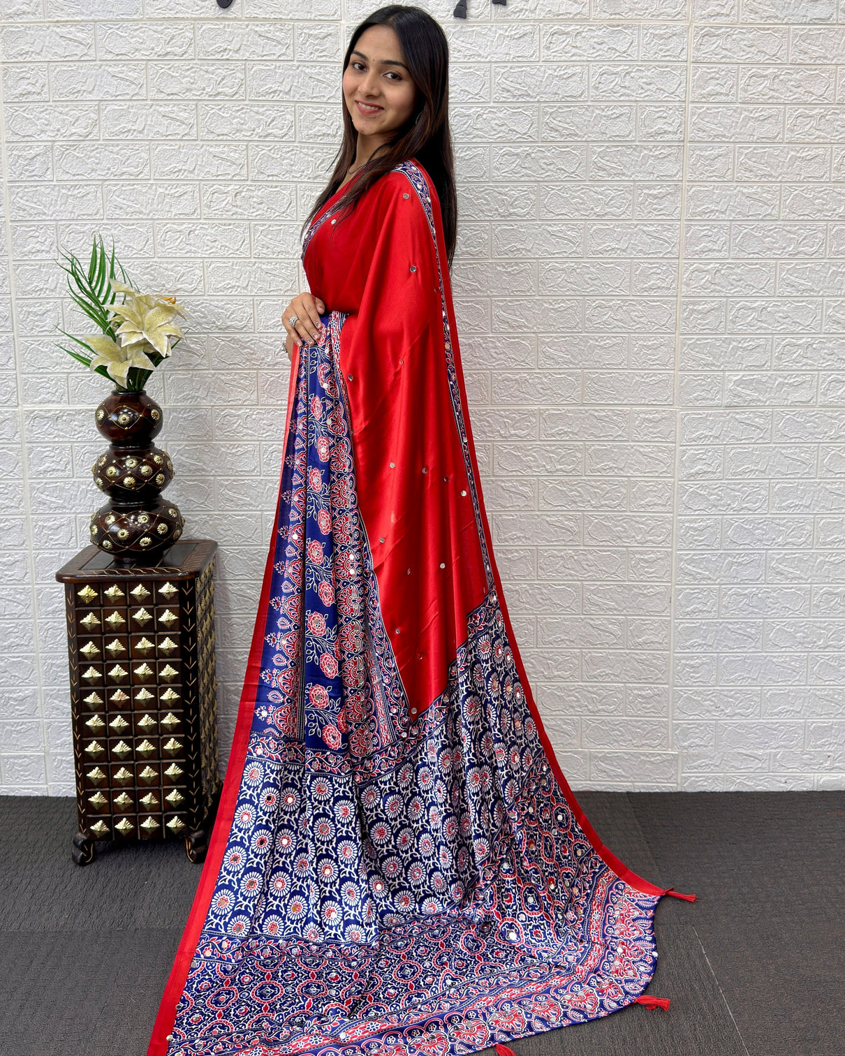 Scarlet red modal silk saree with navy blue ajrakh printed designer pallu tassel detailing festive traditional ethnic wear saree