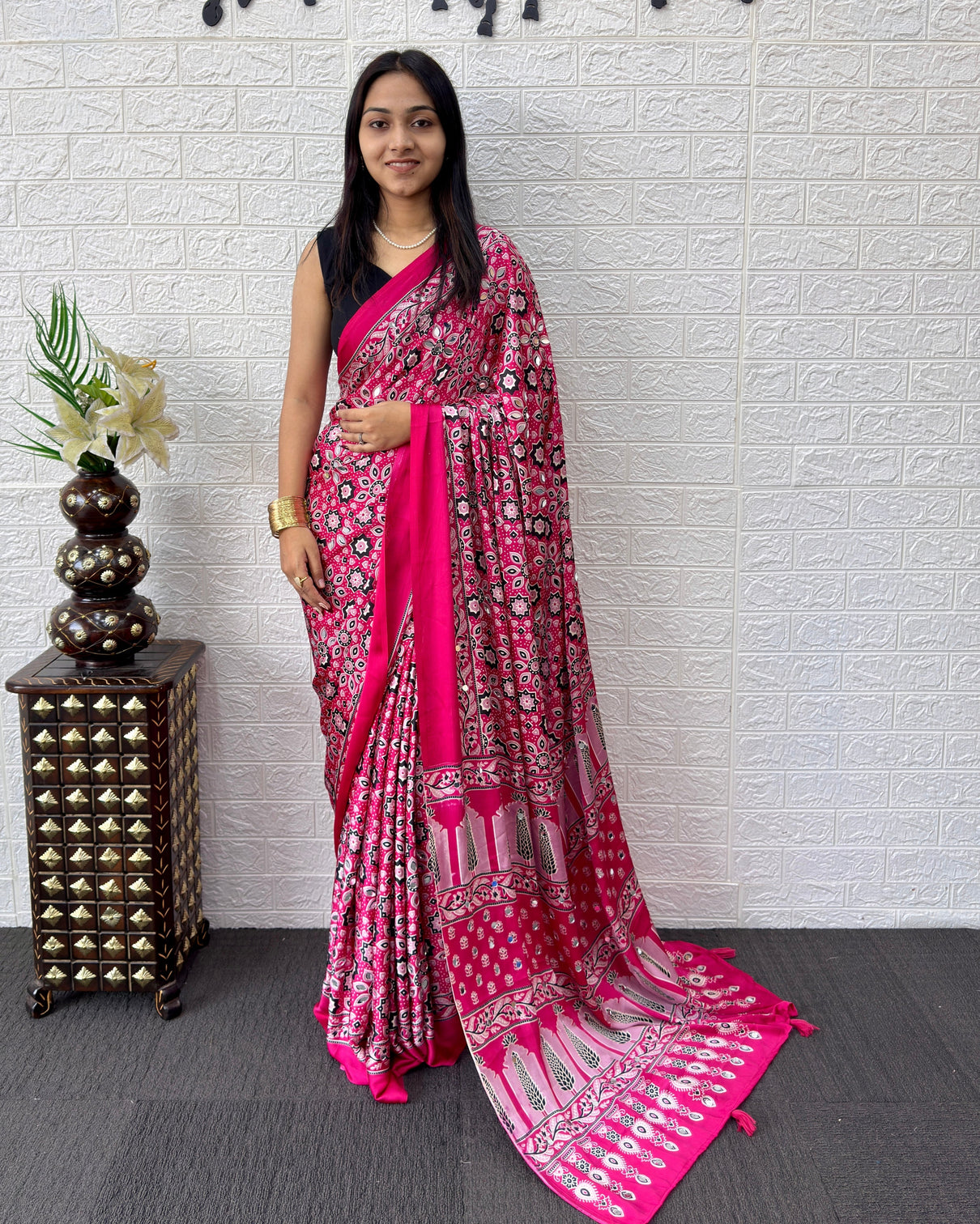 Rani pink modal silk saree with geometric floral print heritage designer pallu festive party wear saree