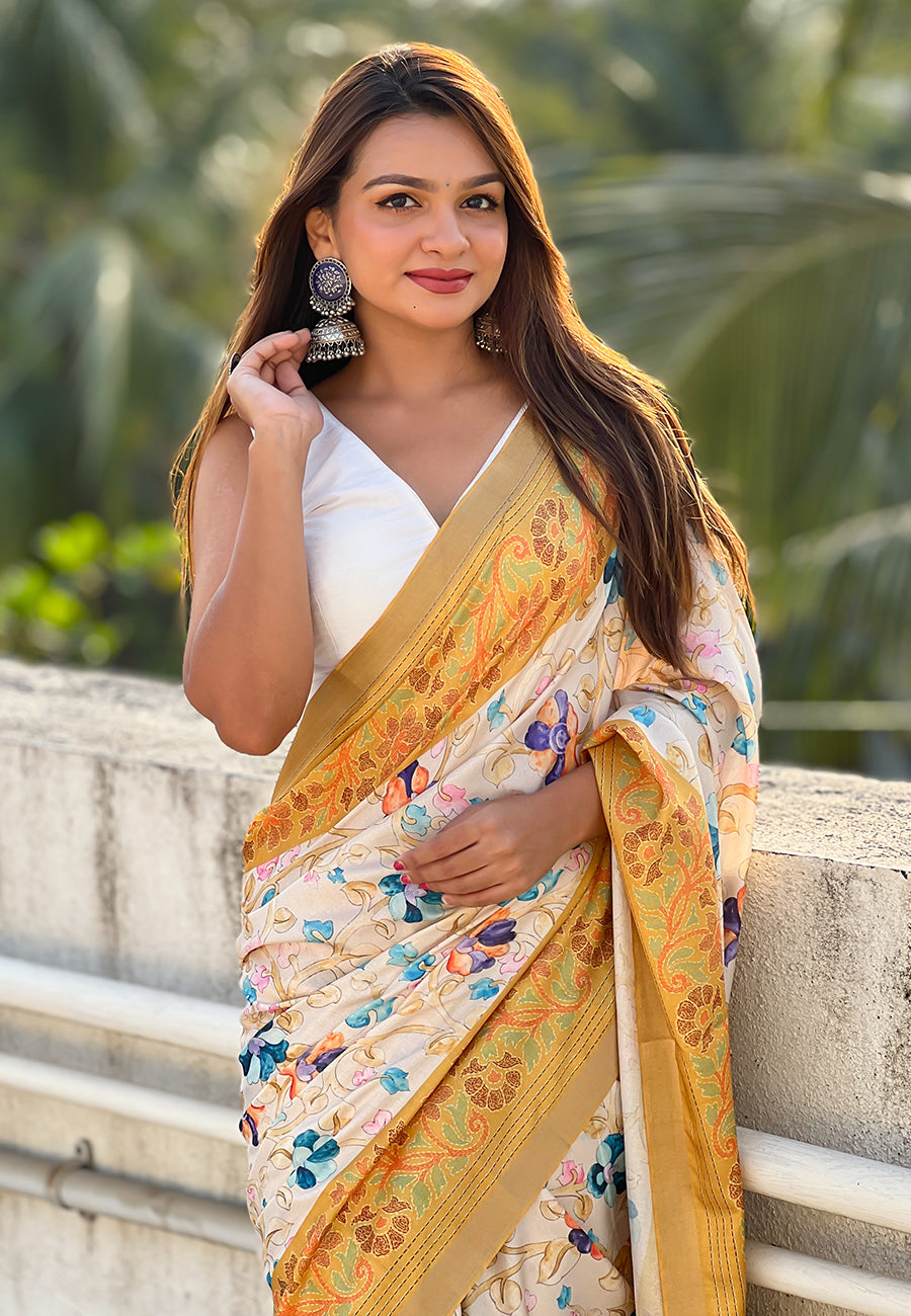 Gold tussar silk kalamkari printed saree with zari woven border