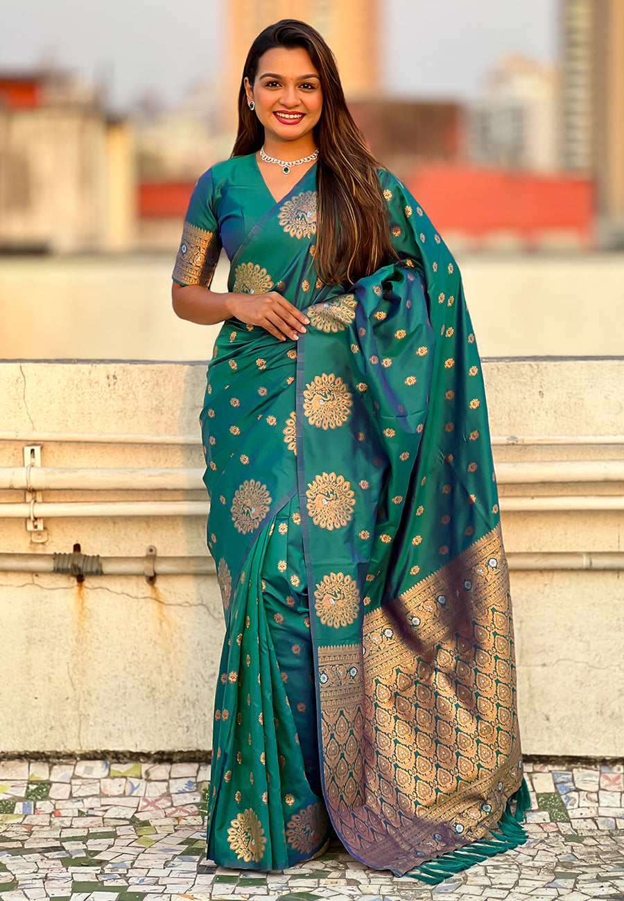 Green soft silk dual zari woven saree with peacock border