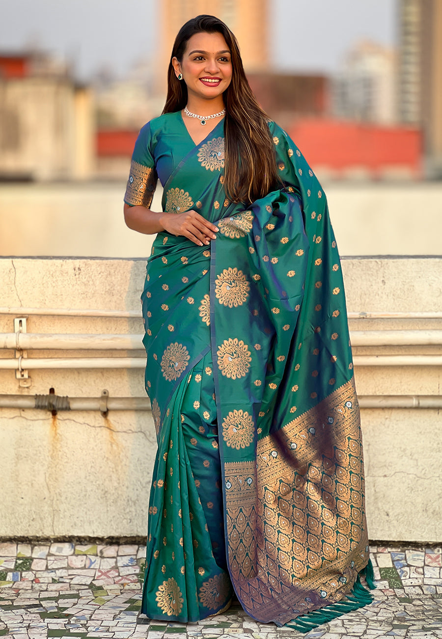Green soft silk dual zari woven saree with peacock border