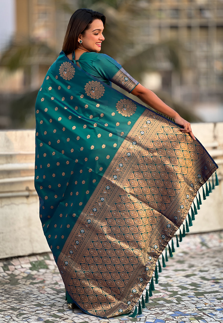 Green soft silk dual zari woven saree with peacock border