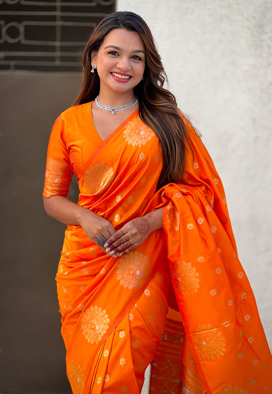 Orange soft silk dual zari woven saree with peacock border