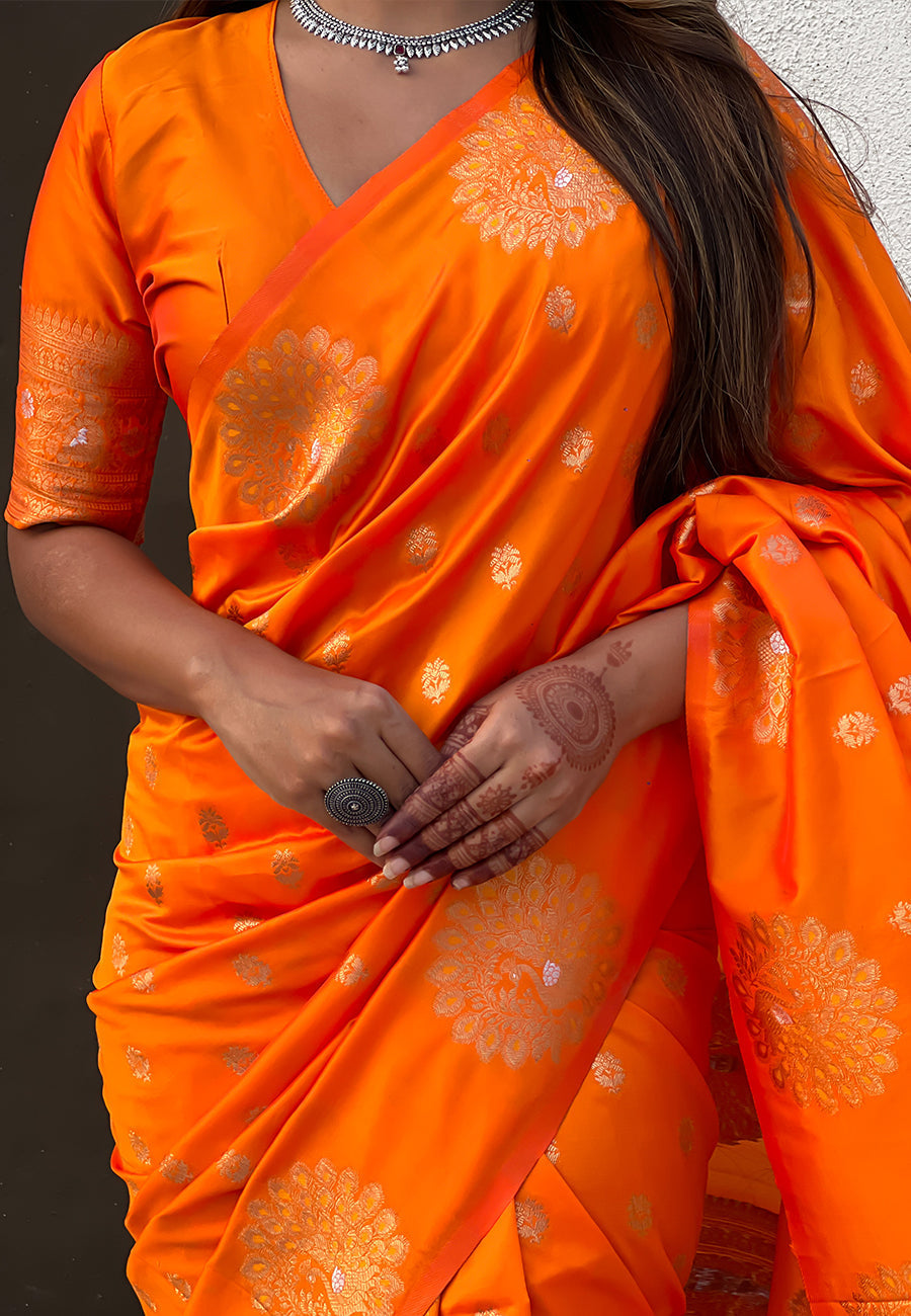 Orange soft silk dual zari woven saree with peacock border