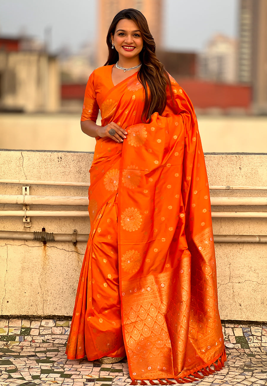 Orange soft silk dual zari woven saree with peacock border