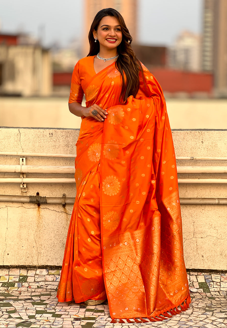 Orange soft silk dual zari woven saree with peacock border