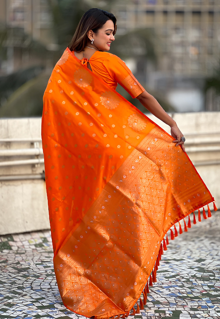 Orange soft silk dual zari woven saree with peacock border