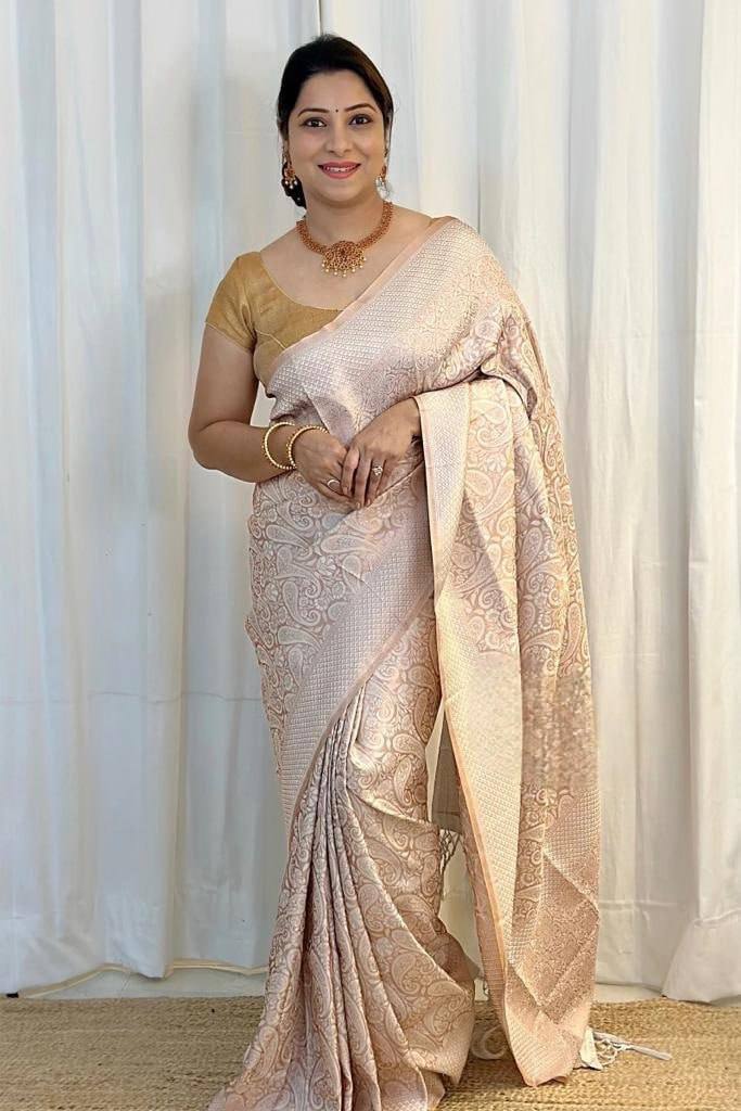 Cynosure Beige Soft Silk Saree With Glittering Blouse Piece