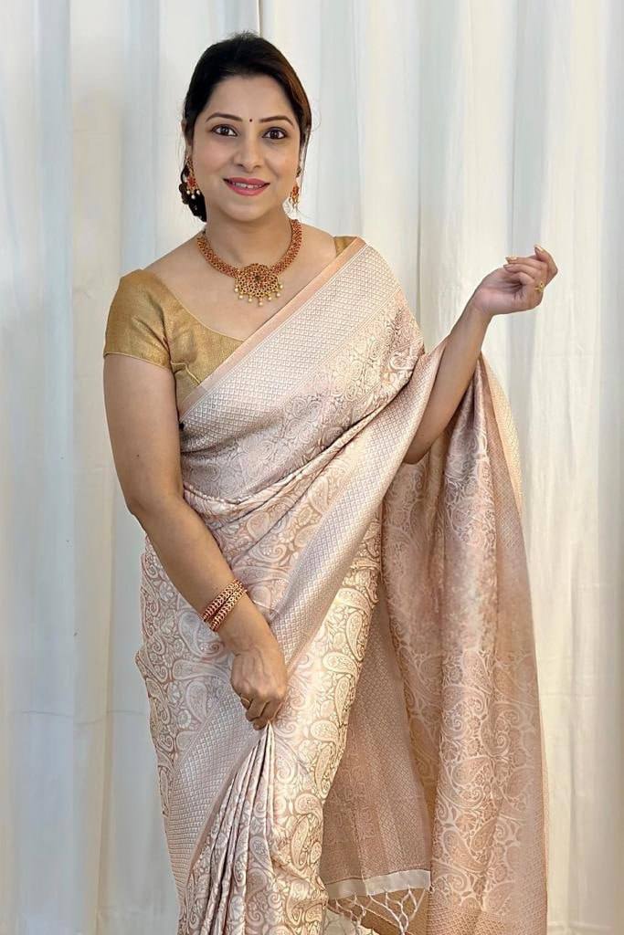 Cynosure Beige Soft Silk Saree With Glittering Blouse Piece
