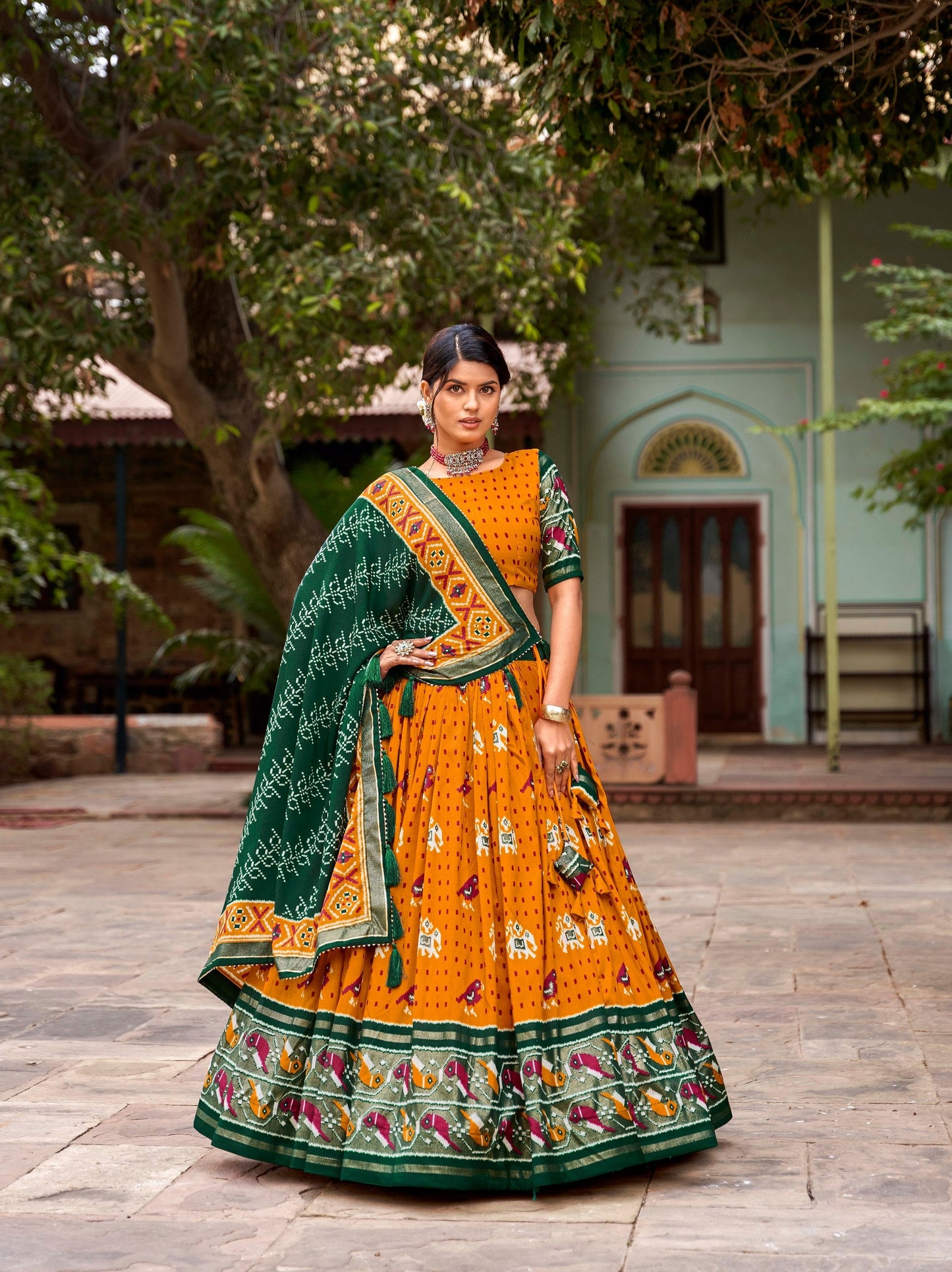 Mustard Colored Tussar Silk Patola Printed Festive Wear Lehenga Choli