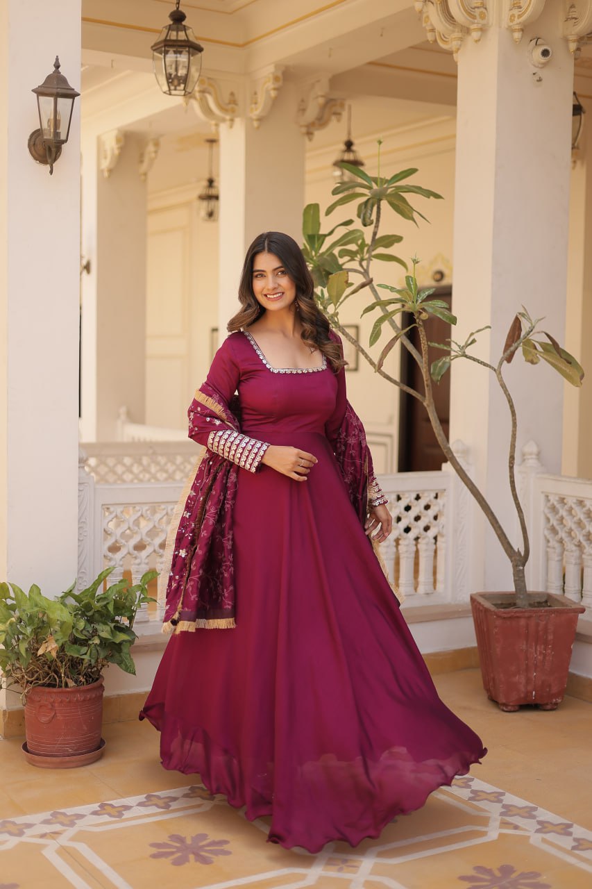 Embrace timeless elegance with our meticulously crafted Vichitra silk Magenta Pink gown and dupatta set.