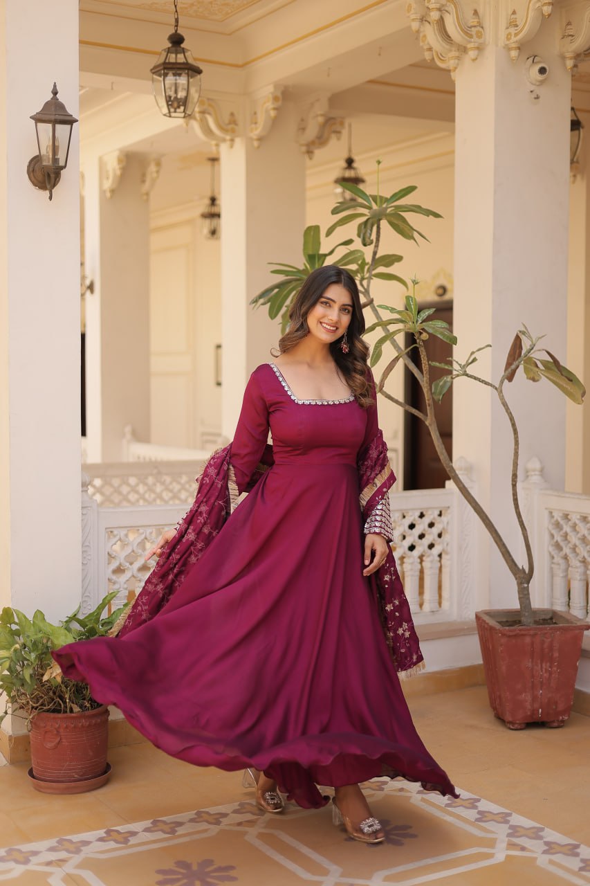 Embrace timeless elegance with our meticulously crafted Vichitra silk Magenta Pink gown and dupatta set.
