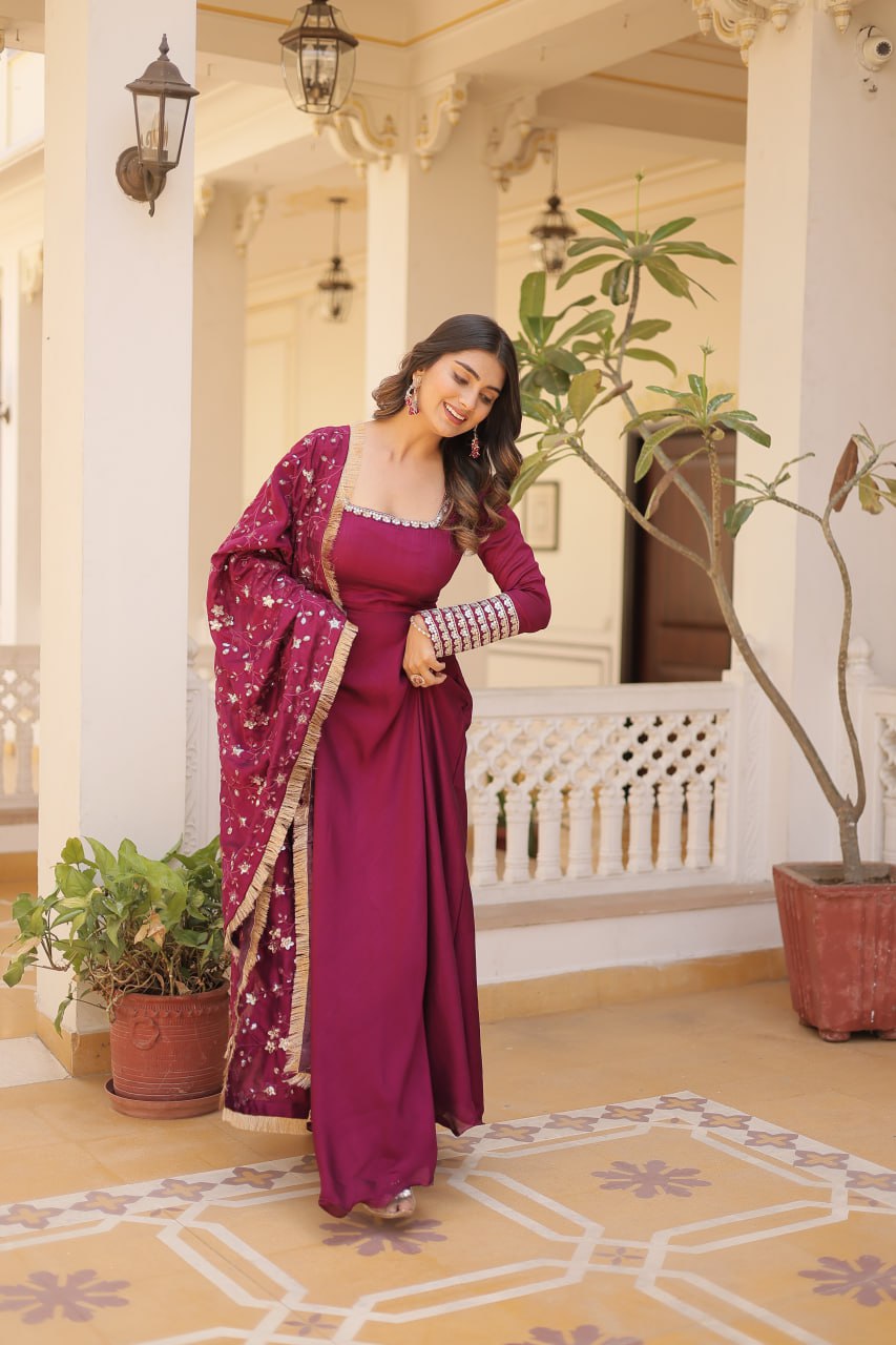 Embrace timeless elegance with our meticulously crafted Vichitra silk Magenta Pink gown and dupatta set.