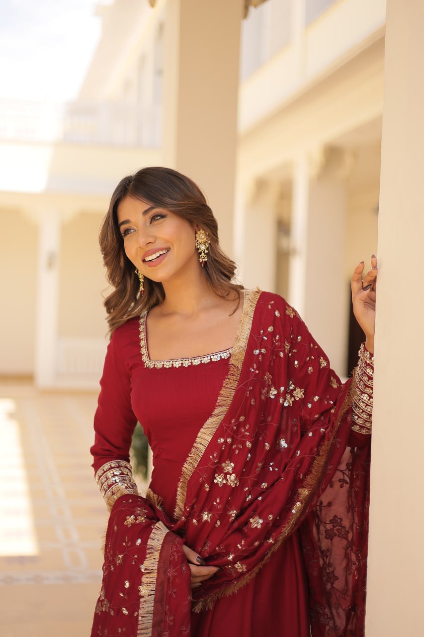 Embrace timeless elegance with our meticulously crafted Vichitra silk Maroon gown and dupatta set.