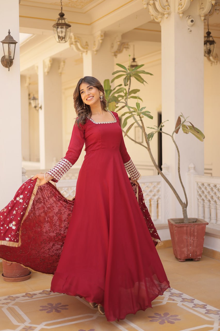 Embrace timeless elegance with our meticulously crafted Vichitra silk Maroon gown and dupatta set.