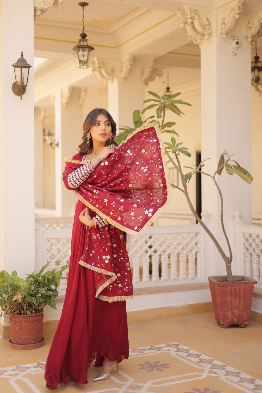 Embrace timeless elegance with our meticulously crafted Vichitra silk Maroon gown and dupatta set.