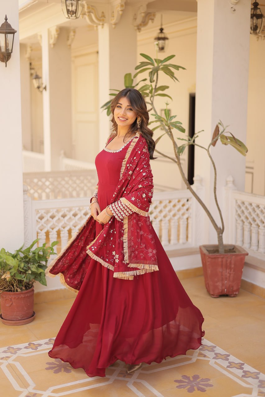 Embrace timeless elegance with our meticulously crafted Vichitra silk Maroon gown and dupatta set.