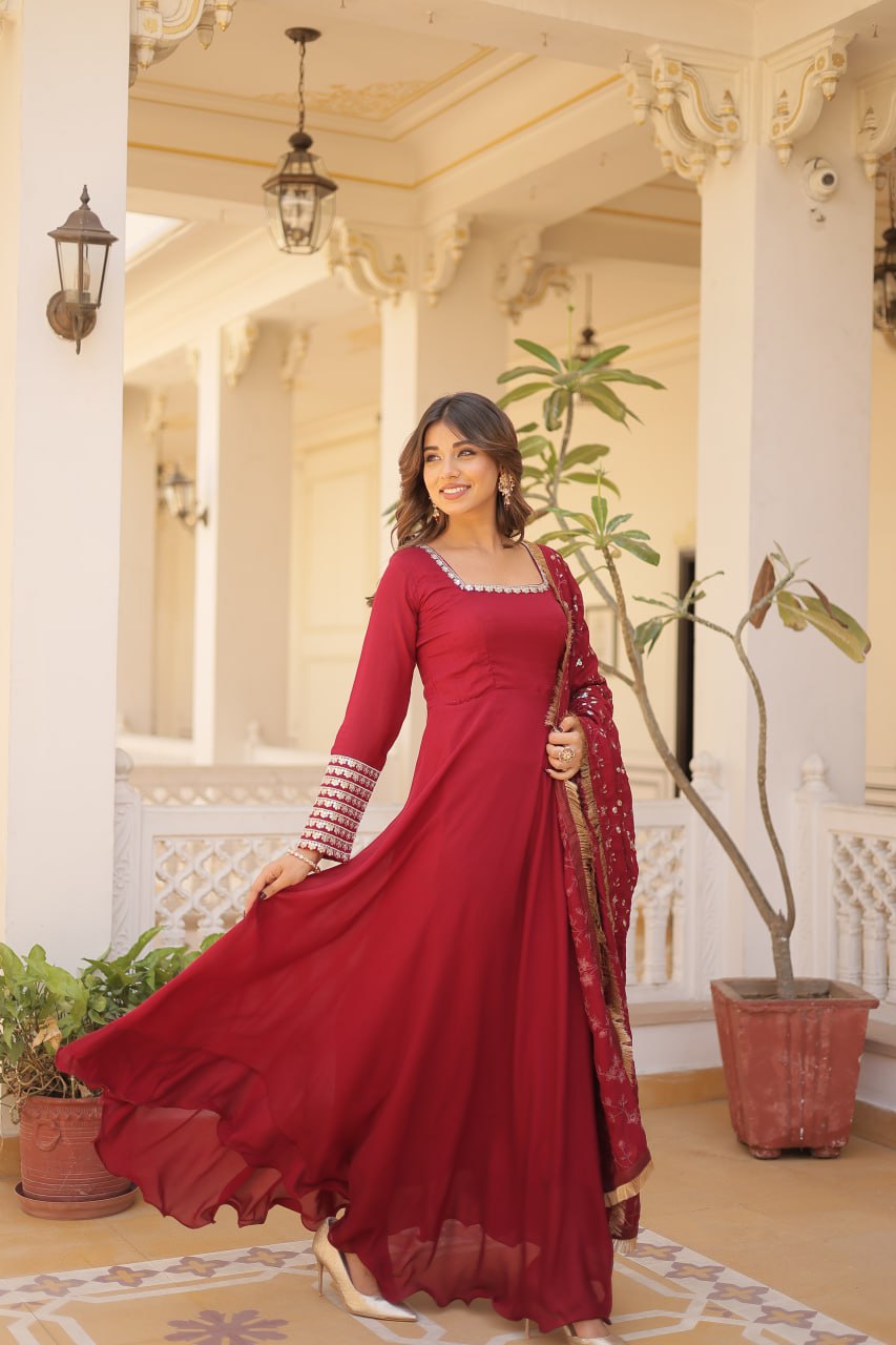 Embrace timeless elegance with our meticulously crafted Vichitra silk Maroon gown and dupatta set.