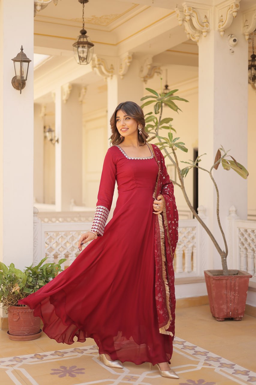 Embrace timeless elegance with our meticulously crafted Vichitra silk Maroon gown and dupatta set.
