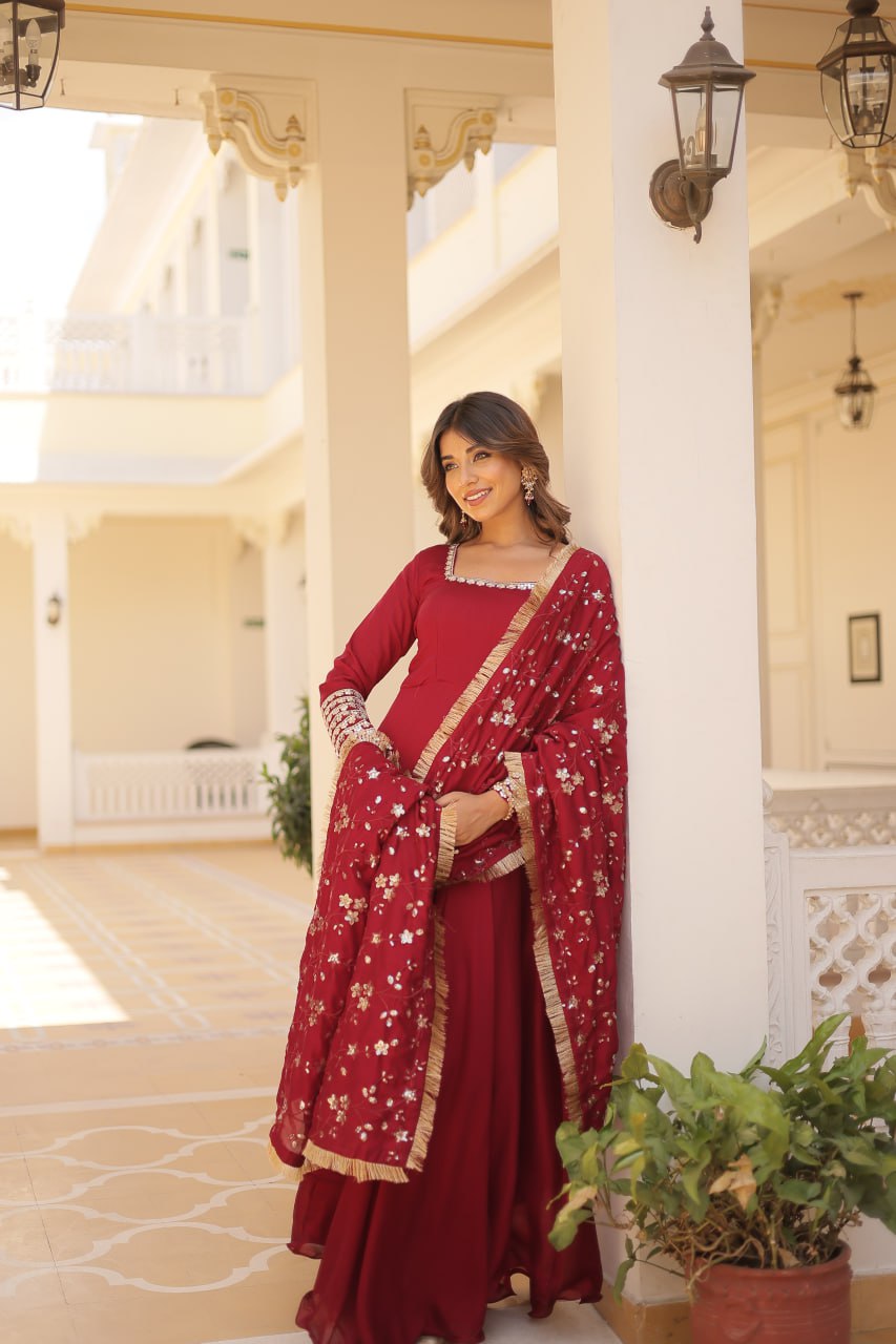 Embrace timeless elegance with our meticulously crafted Vichitra silk Maroon gown and dupatta set.