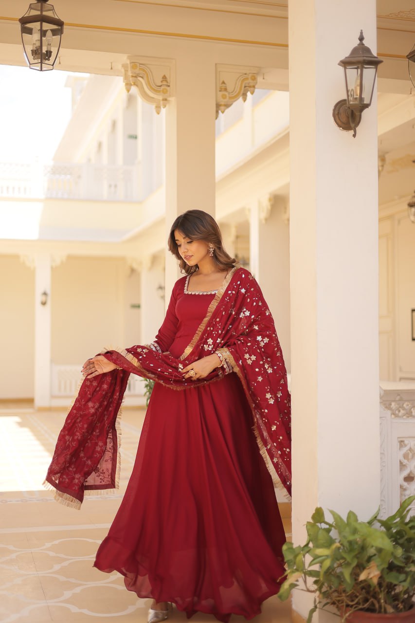 Embrace timeless elegance with our meticulously crafted Vichitra silk Maroon gown and dupatta set.