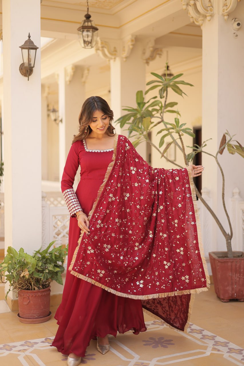 Embrace timeless elegance with our meticulously crafted Vichitra silk Maroon gown and dupatta set.