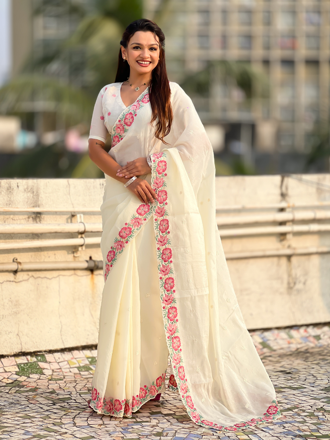 White pure crush embroidered saree with multicolor floral motifs and cutwork border