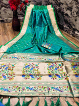 Eye-catching Rama Paithani Silk Saree With Ethnic Blouse Piece