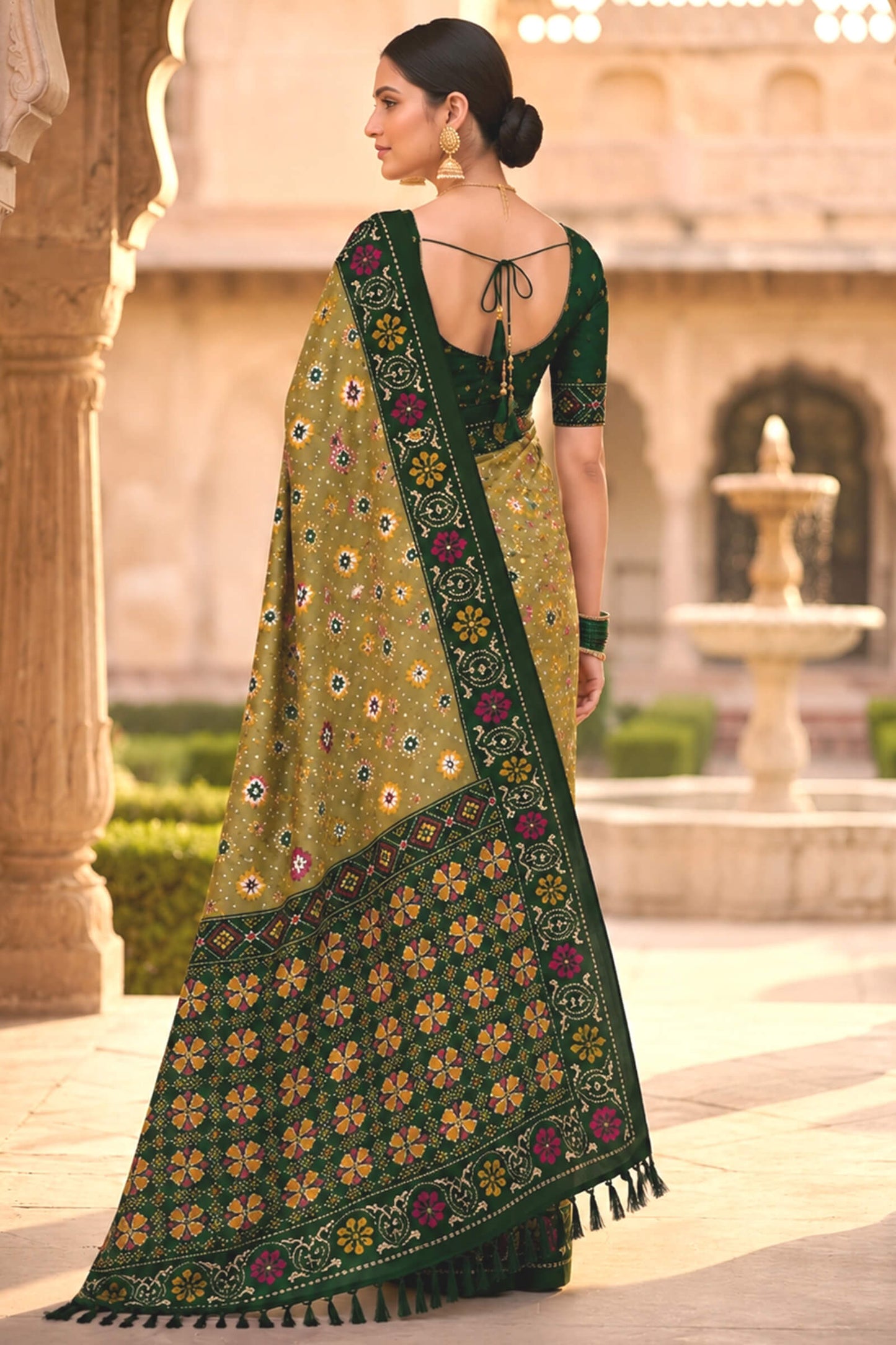 Engaging Green Patola Silk Saree with Smart Blouse Piece