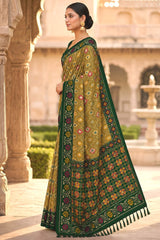Engaging Green Patola Silk Saree with Smart Blouse Piece