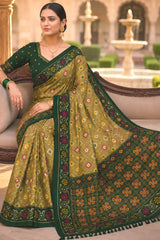 Engaging Green Patola Silk Saree with Smart Blouse Piece