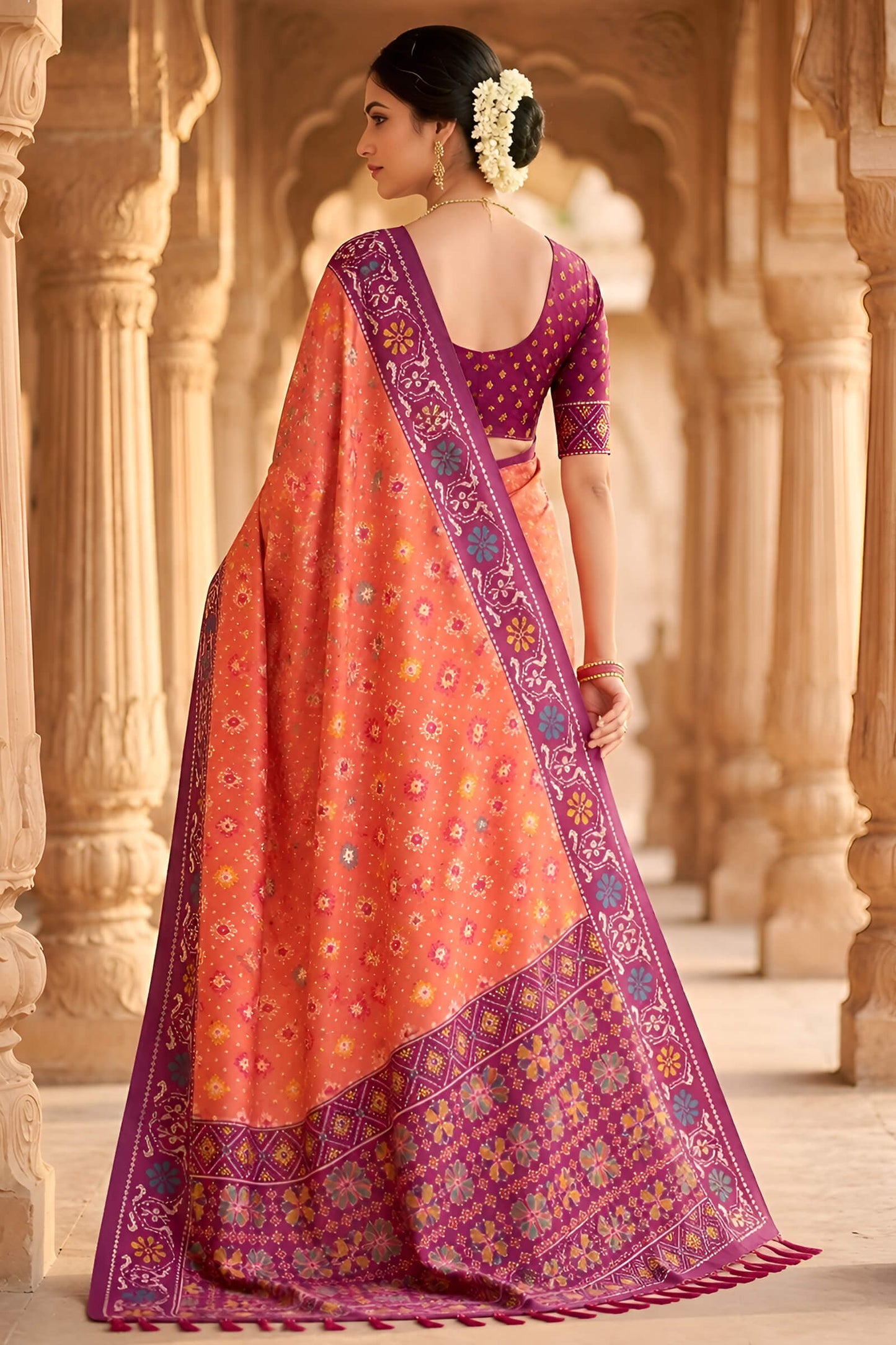 Beauteous Orange Patola Silk Saree with Denouement Blouse Piece