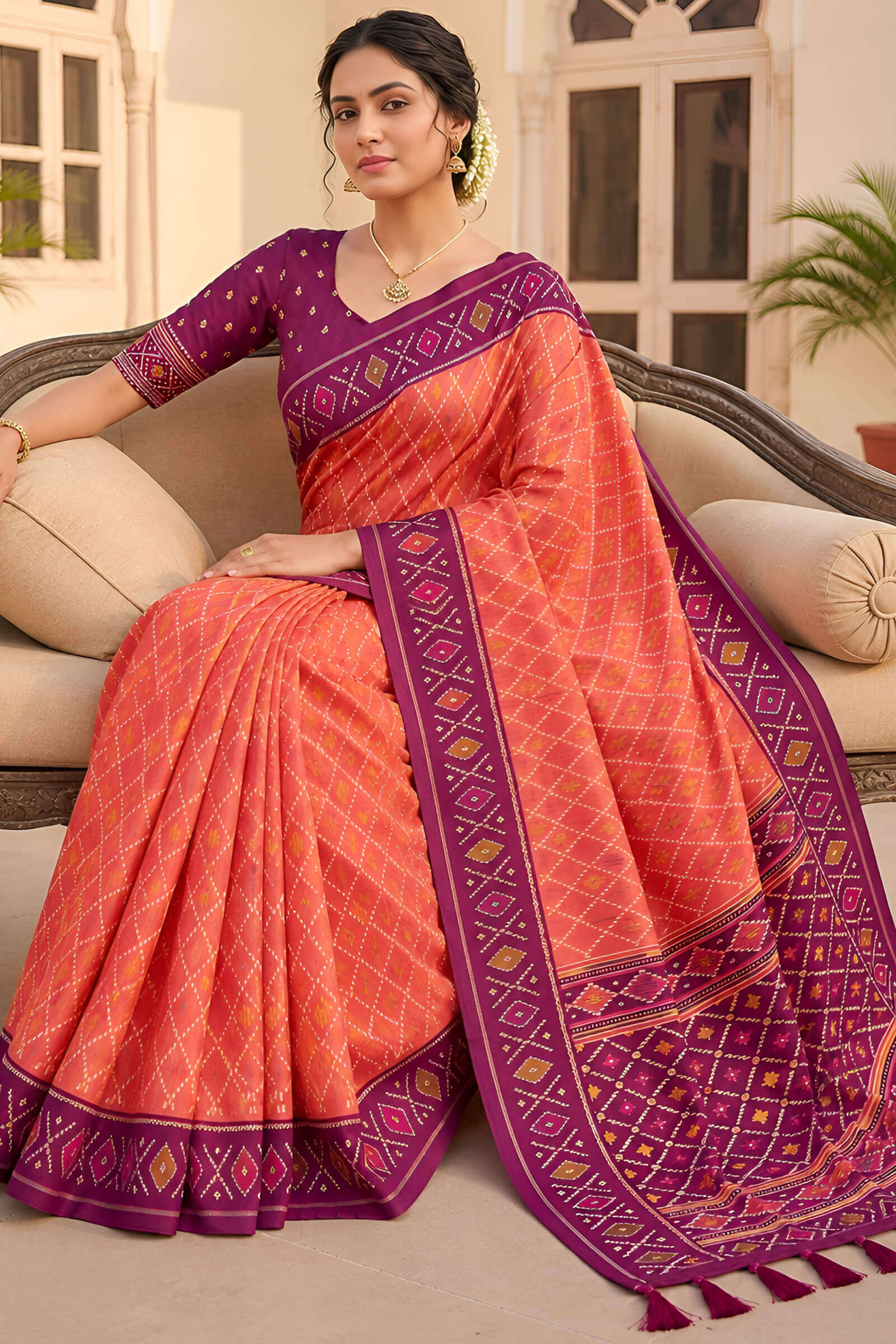 Glorious Orange Patola Silk Saree with Gleaming Blouse Piece