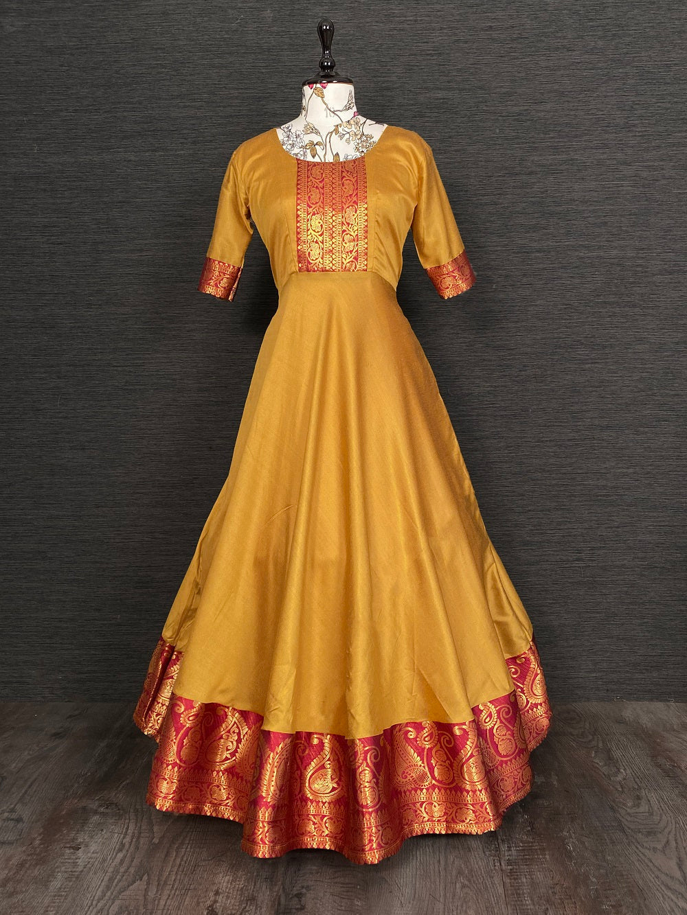 Mustard Color Beautiful Weaving Zari Worked Silk Gown