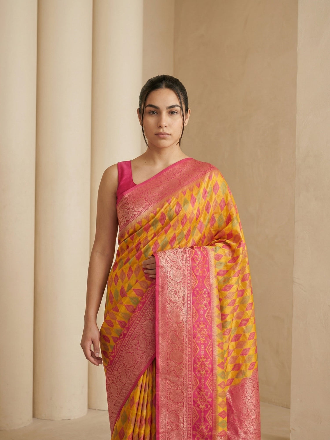 Orange festive patola silk saree with rich ikat weaving