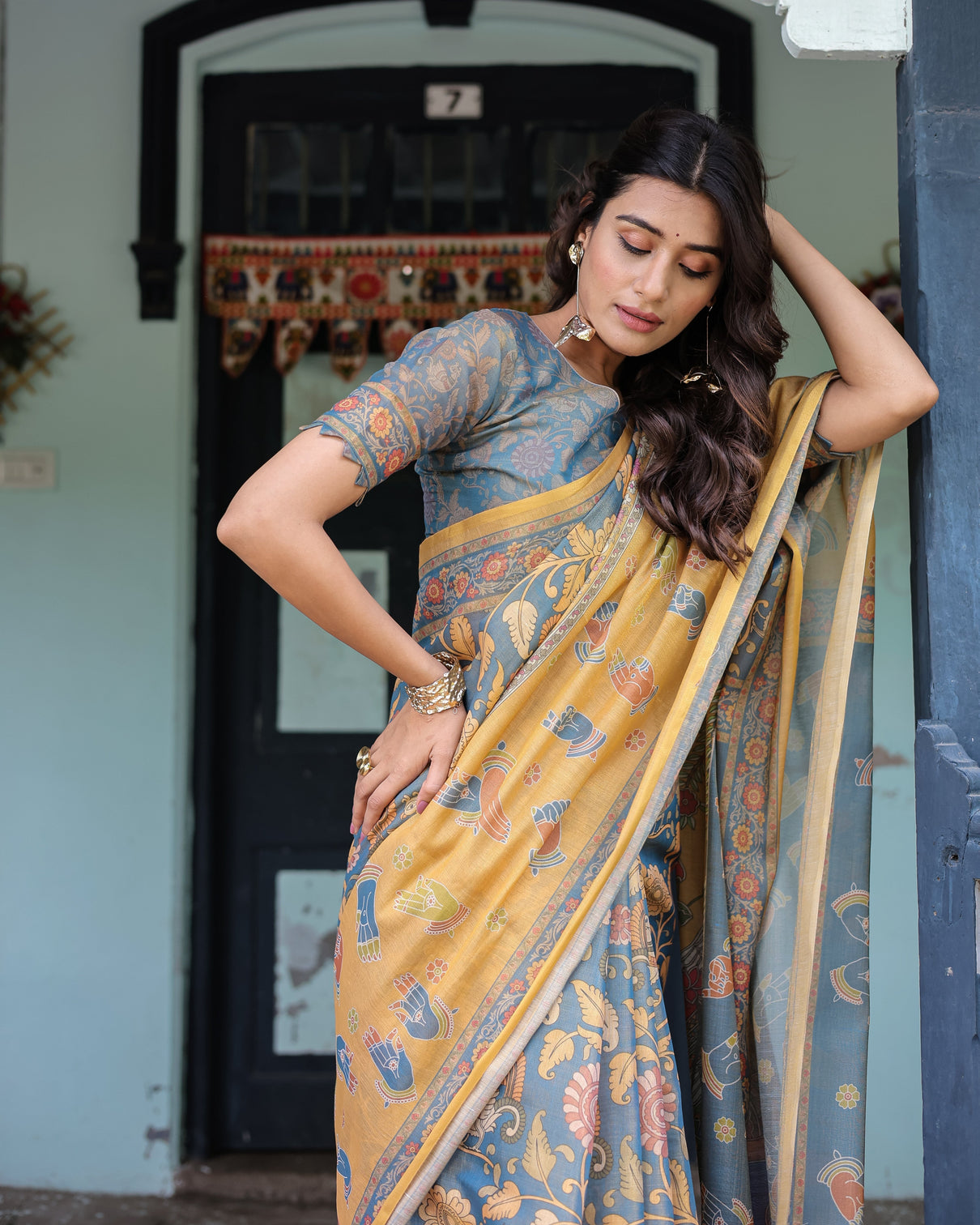 Mustard blue handloom cotton saree with mudra motifs goddess saraswati pallu