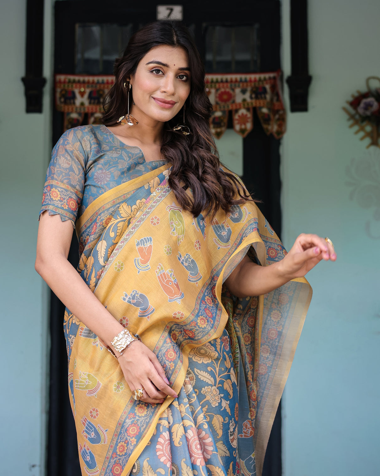 Mustard blue handloom cotton saree with mudra motifs goddess saraswati pallu