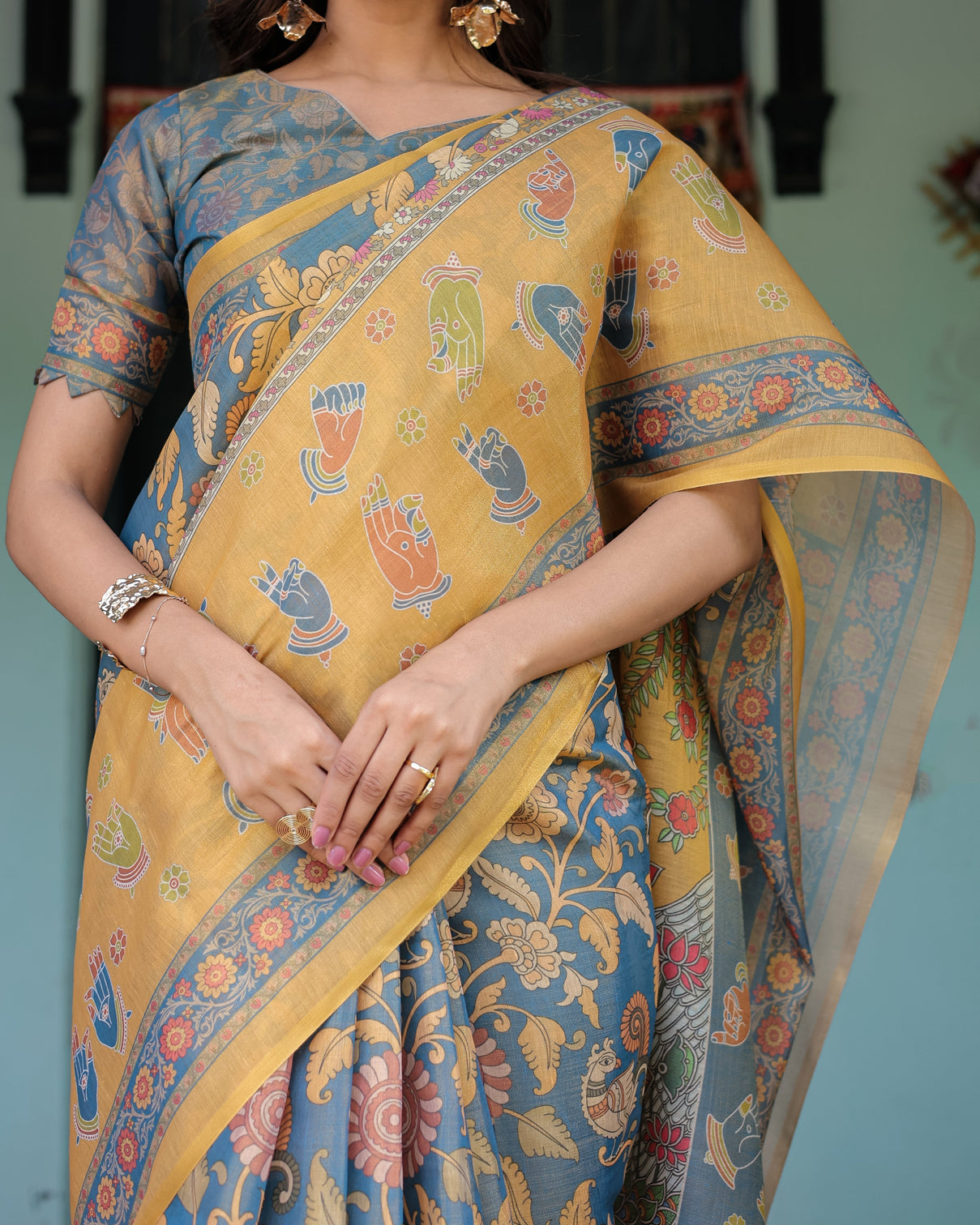 Mustard blue handloom cotton saree with mudra motifs goddess saraswati pallu