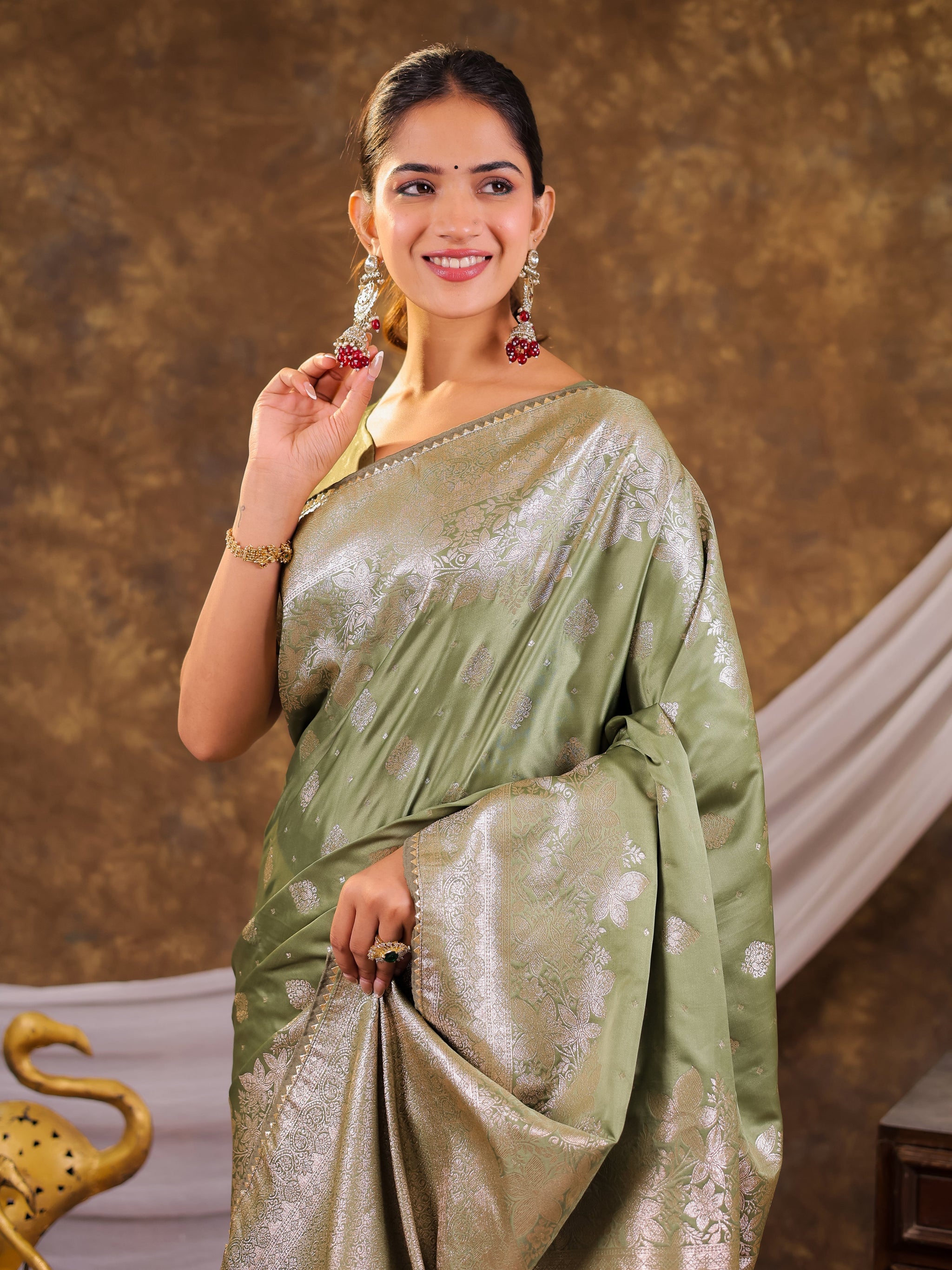 Sage Green Kanjivaram Banarasi Satin Silk Saree with Silver Zari Weaving, Floral Woven Border, Rich Designer Pallu & Tassels