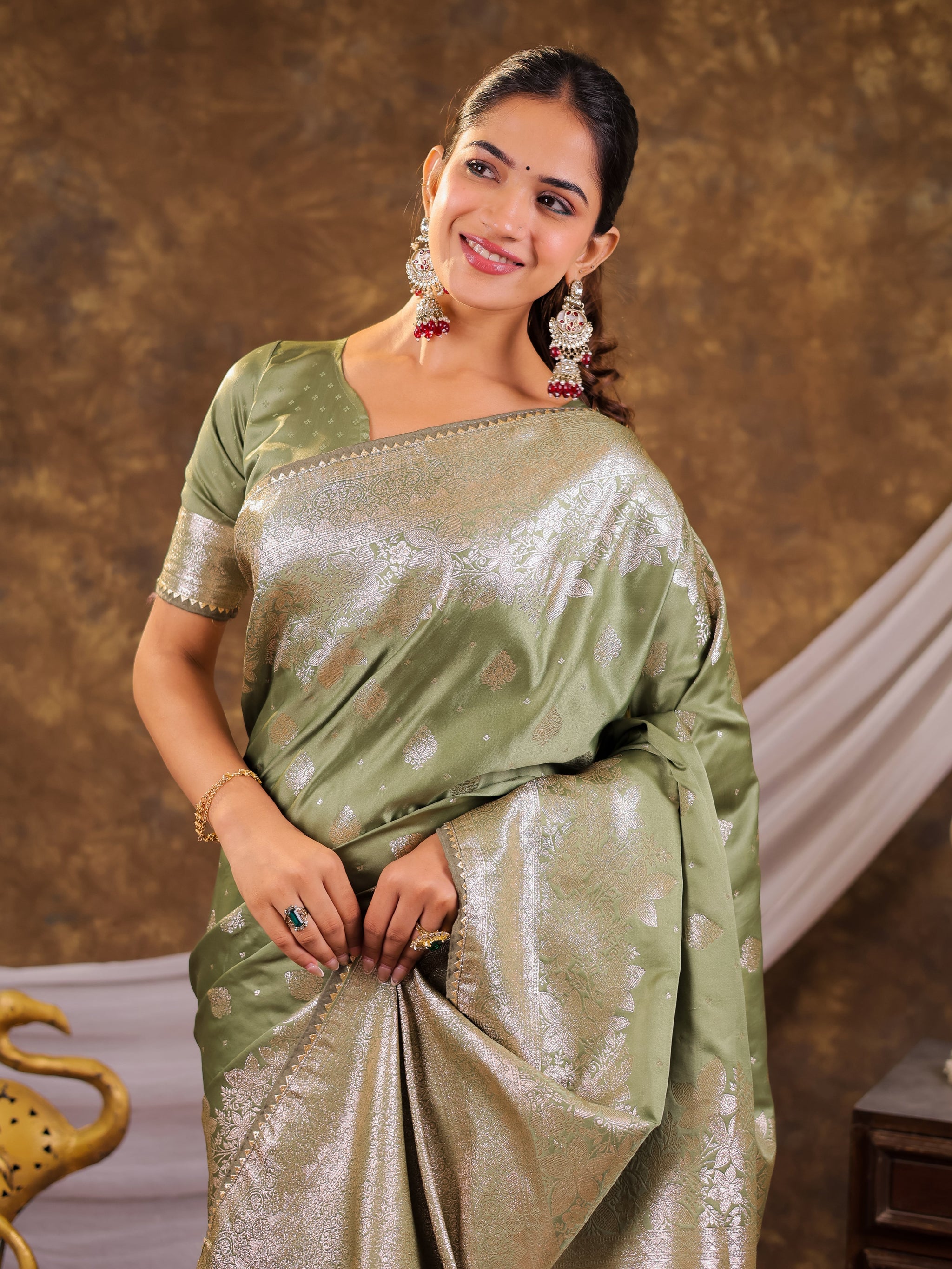 Sage Green Kanjivaram Banarasi Satin Silk Saree with Silver Zari Weaving, Floral Woven Border, Rich Designer Pallu & Tassels