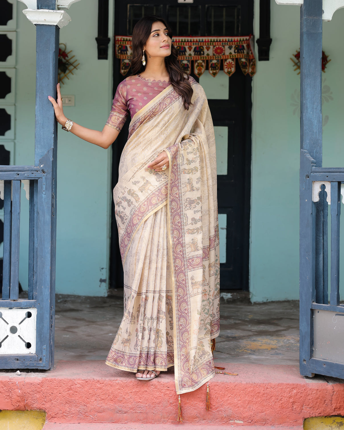 Beige mauve handloom cotton saree with subtle ramayan print and heritage motif pallu