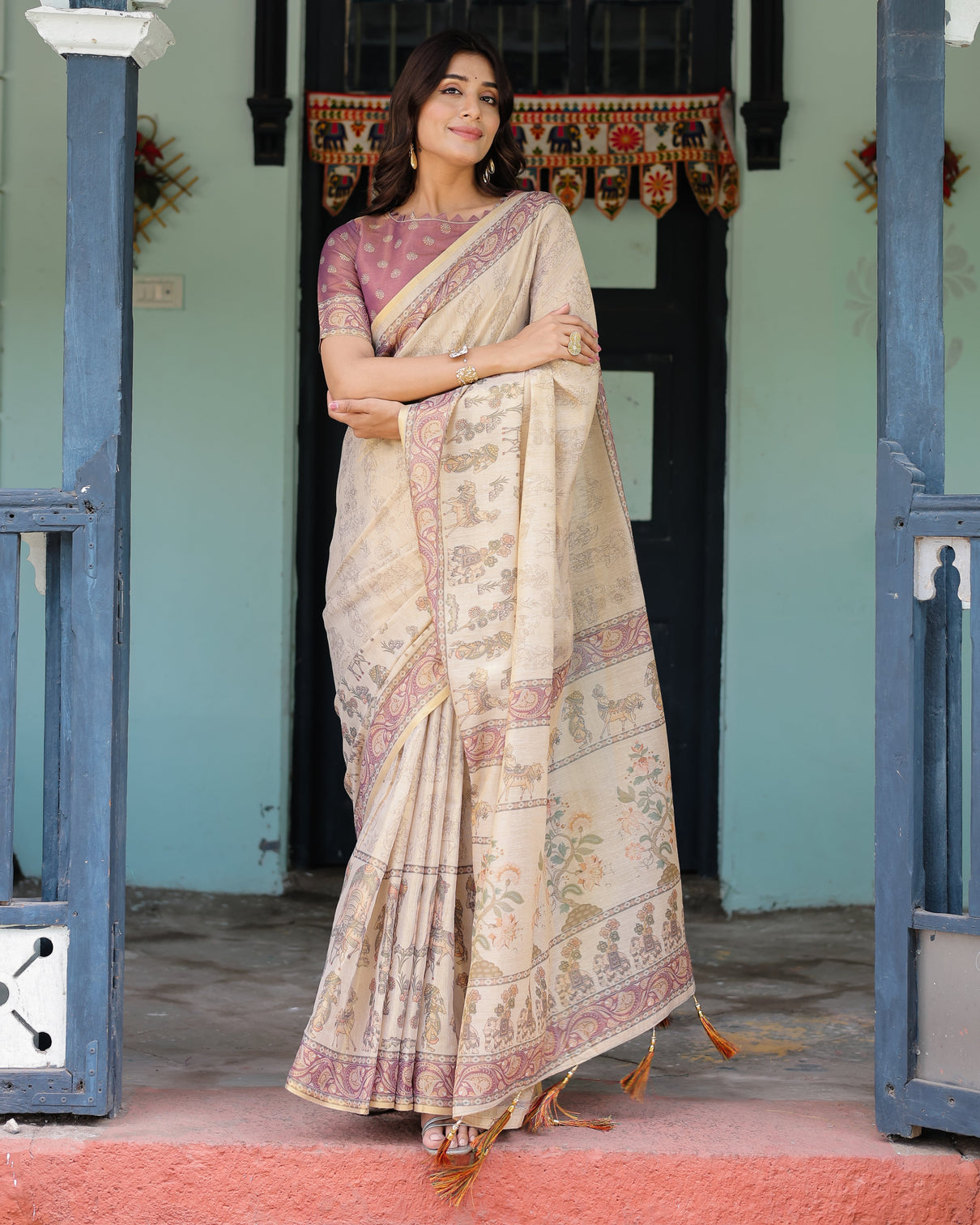 Beige mauve handloom cotton saree with subtle ramayan print and heritage motif pallu