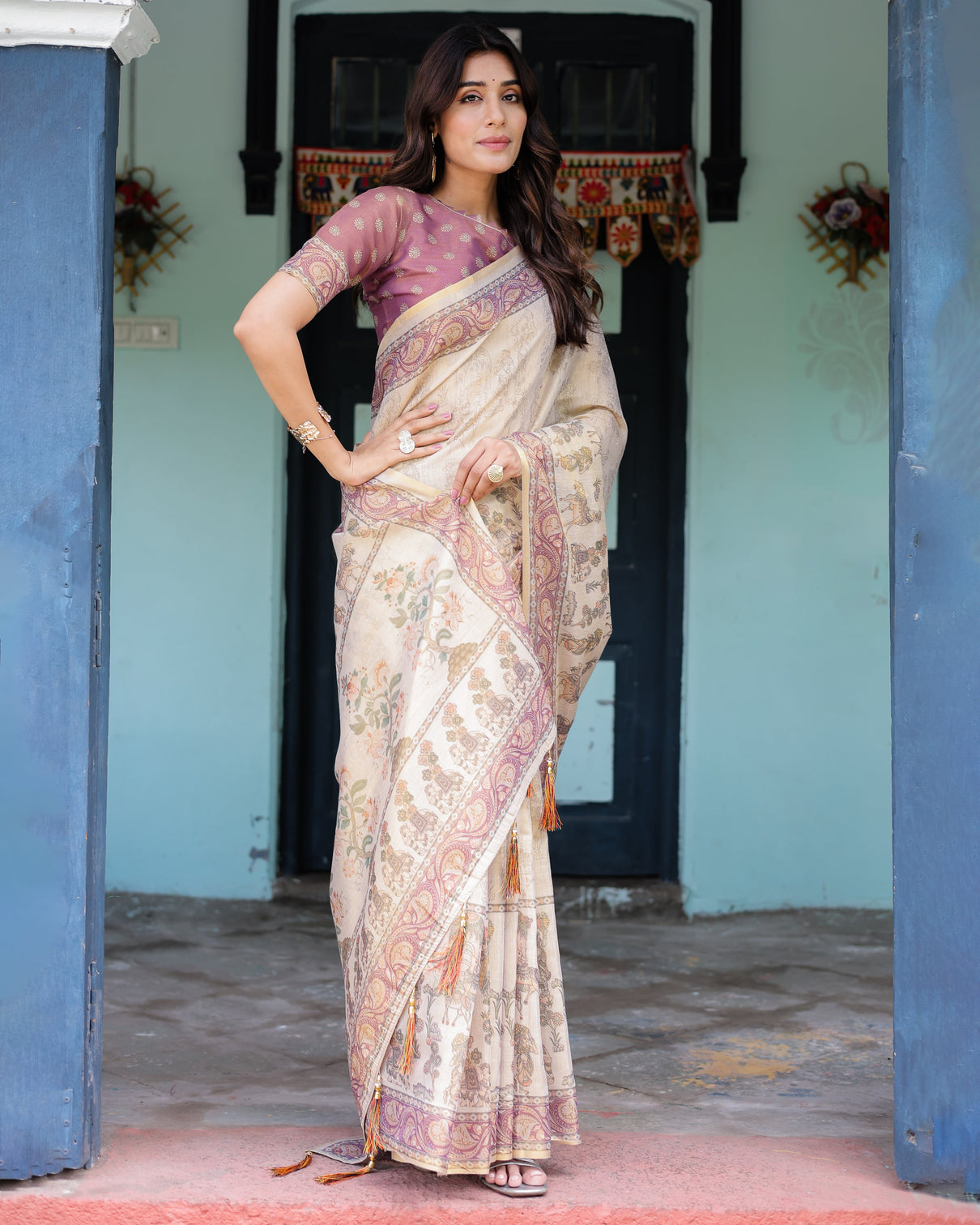 Beige mauve handloom cotton saree with subtle ramayan print and heritage motif pallu