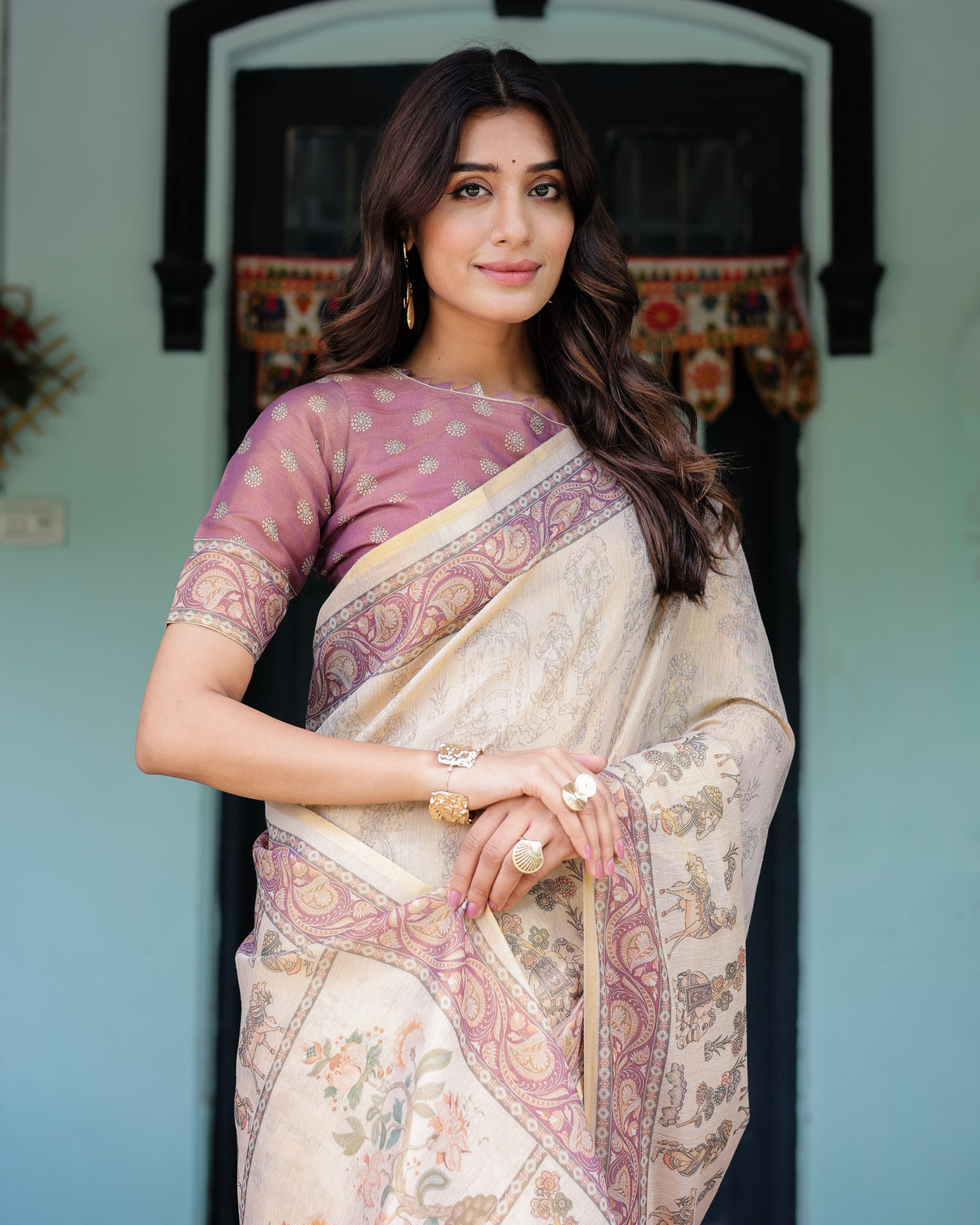 Beige mauve handloom cotton saree with subtle ramayan print and heritage motif pallu