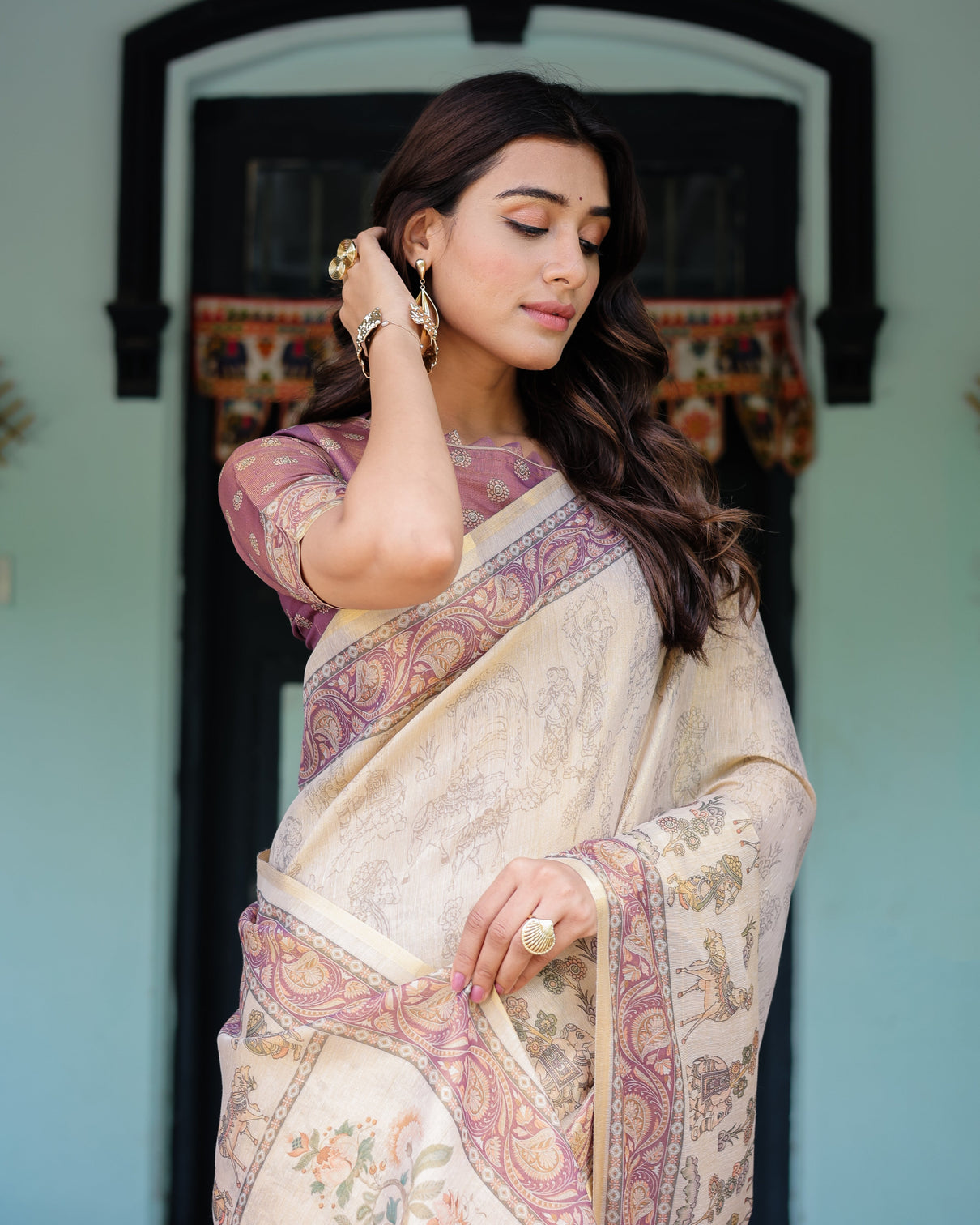 Beige mauve handloom cotton saree with subtle ramayan print and heritage motif pallu